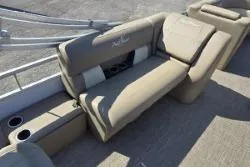 Slide: The Image of 2025 SunChaser Vista 22 Fish boat interior seating with cup holders. - 10