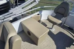 Slide: The Image of 2025 SunChaser Vista 22 Fish boat interior with seating and storage. - 7