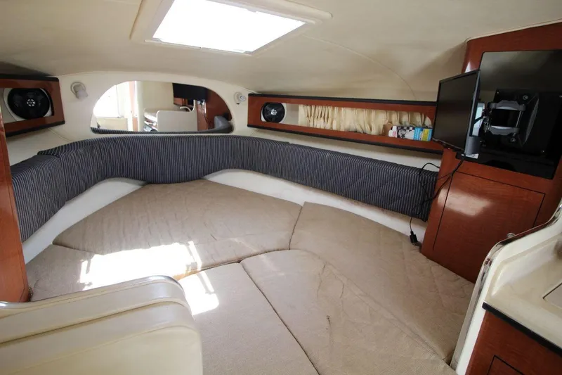 Slide: The Image of Interior of 2005 Sea Ray 280 Sundancer boat with cozy seating and entertainment system. - 14