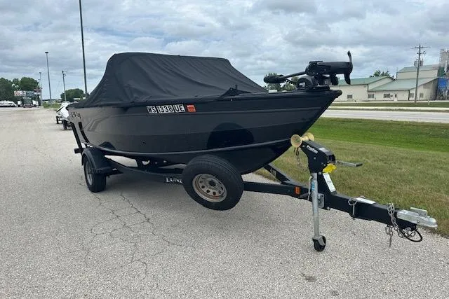 The Image of 2020 Lund 1775 Adventure Sport boat on trailer, covered, parked on roadside. - 0