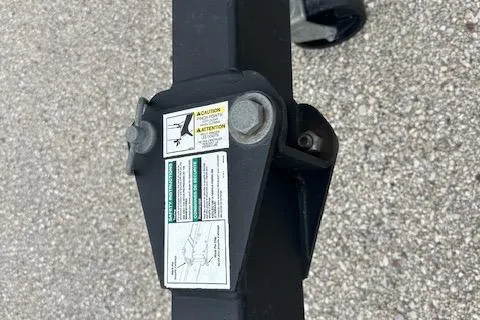 Slide: The Image of Close-up of a 2020 Lund 1775 Adventure Sport trailer hitch with caution labels. - 15