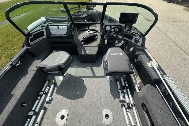 Slide: The Image of 2020 Lund 1775 Adventure Sport boat interior with seating and steering console. - 2