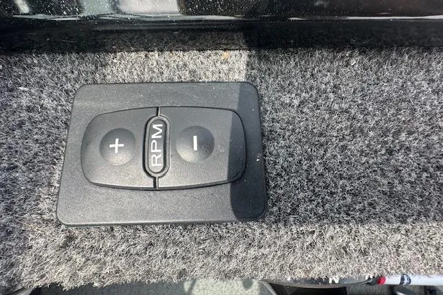 Slide: The Image of Control panel on 2020 Lund 1775 Adventure Sport boat, featuring RPM adjustment buttons. - 7