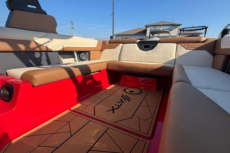 Slide: The Image of Interior of 2026 ATX Surf Boats 24 Type-S with red and tan seating. - 12