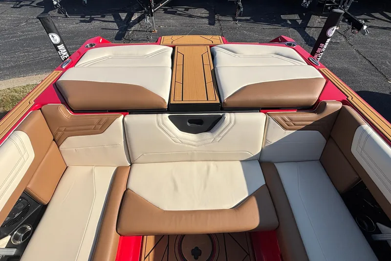Slide: The Image of 2026 ATX Surf Boats 24 Type-S interior with tan and white seating. - 21