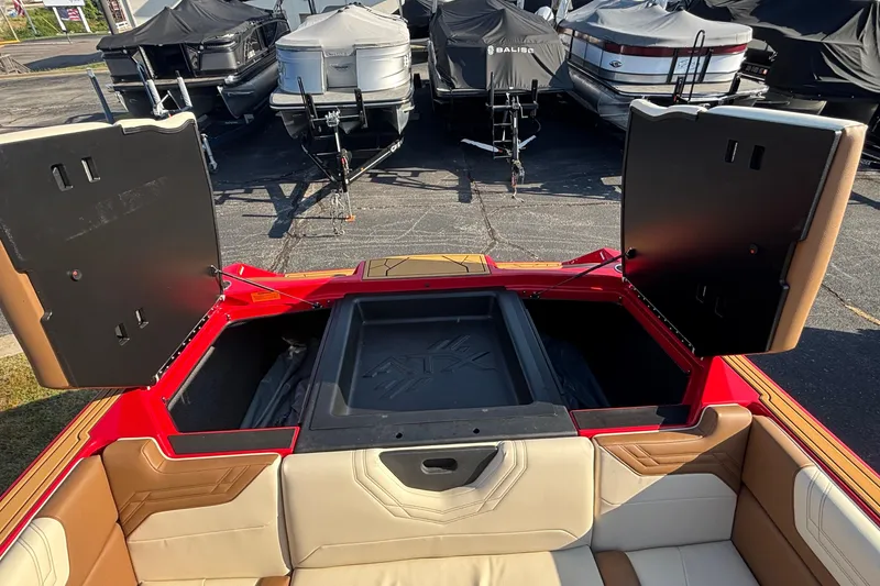 Slide: The Image of 2026 ATX Surf Boats 24 Type-S interior with open storage compartments, showcasing seating and design. - 25