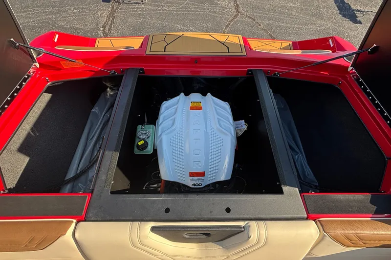 Slide: The Image of 2026 ATX Surf Boats 24 Type-S engine compartment with red exterior and tan interior. - 26