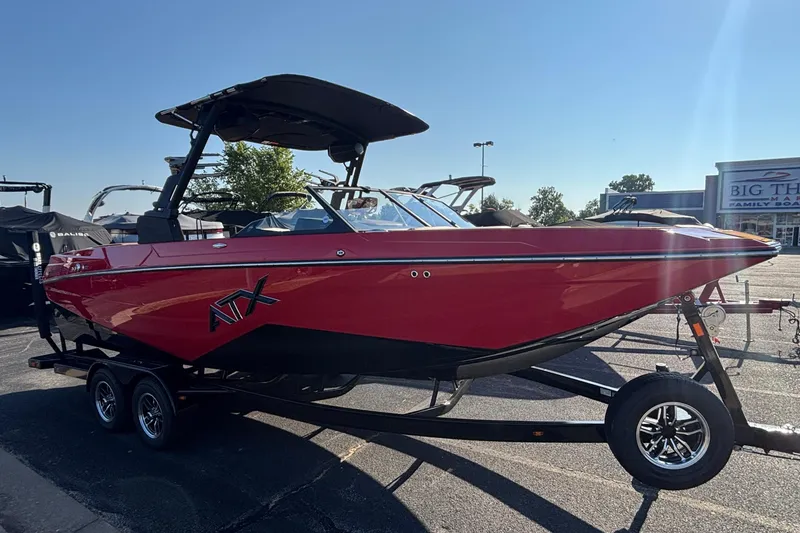 Slide: The Image of 2026 ATX Surf Boats 24 Type-S in vibrant red on trailer, parked outdoors. - 3