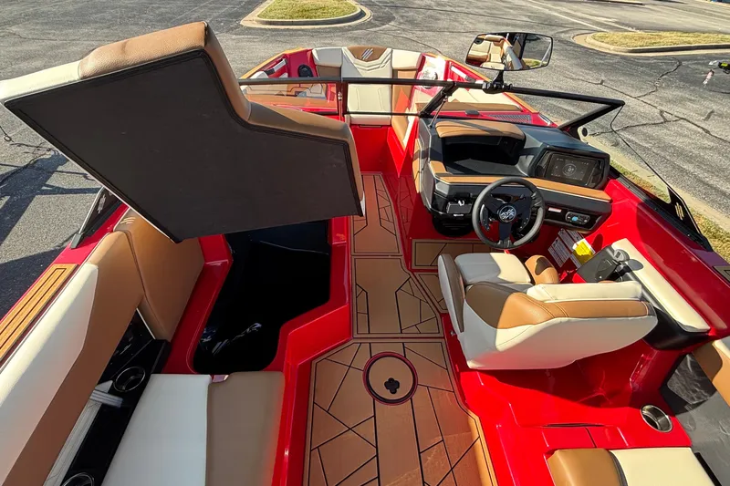 Slide: The Image of 2026 ATX Surf Boats 24 Type-S interior with red and tan seating, modern dashboard, and sleek design. - 31