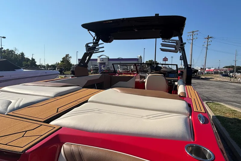 Slide: The Image of 2026 ATX Surf Boats 24 Type-S, red exterior, spacious seating, parked outdoors. - 5