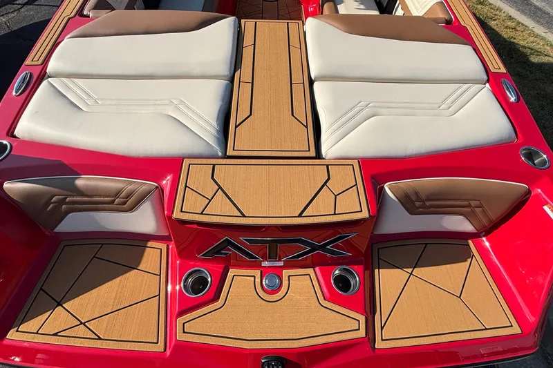Slide: The Image of 2026 ATX Surf Boats 24 Type-S interior with red and tan upholstery, showcasing sleek design. - 6