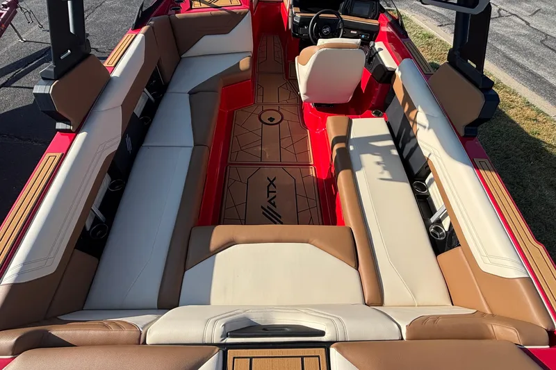 Slide: The Image of 2026 ATX Surf Boats 24 Type-S interior with beige and brown seating, red accents. - 7