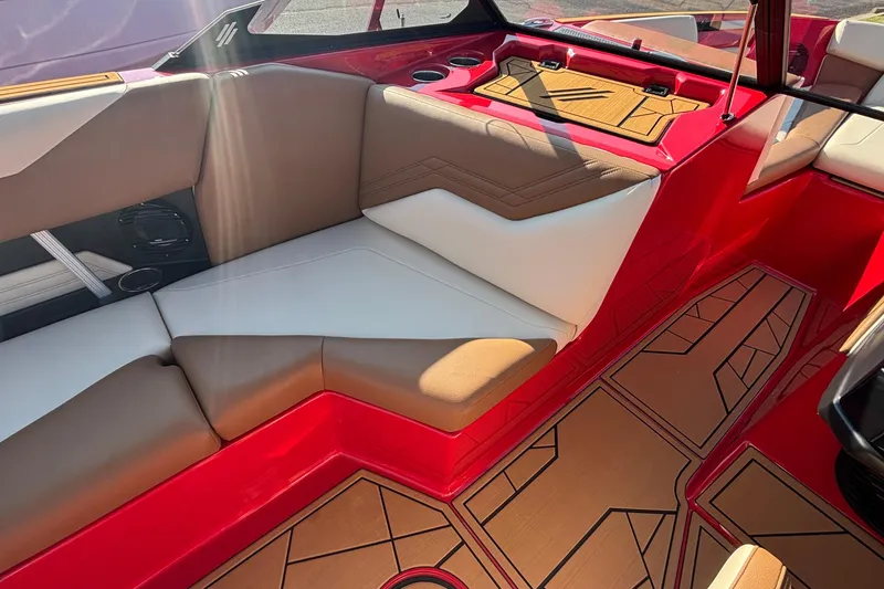 Slide: The Image of 2026 ATX Surf Boats 24 Type-S interior with red and tan seating, geometric flooring. - 9