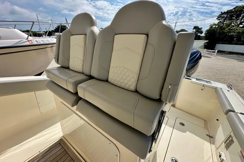Slide: The Image of 2024 Scout 277 LXF boat seats with luxurious beige upholstery. - 10