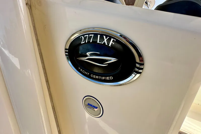 Slide: The Image of 2024 Scout 277 LXF yacht certification badge on boat exterior. - 18