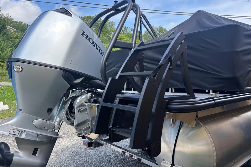 Slide: The Image of 2026 Bentley Pontoons Legacy 220 with Honda engine, featuring dual captain seats and swingback design. - 3