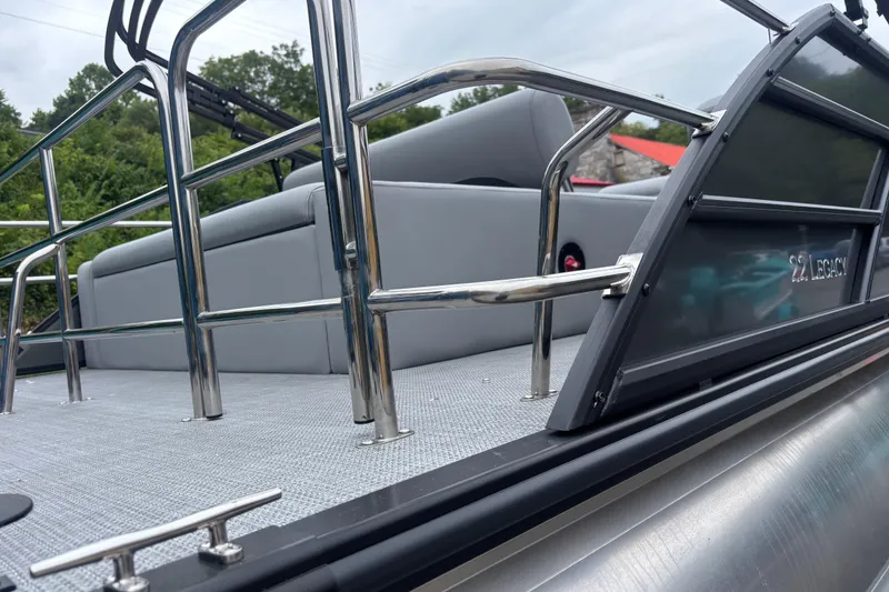 Slide: The Image of 2026 Bentley Pontoons Legacy 220 Swingback Dual Captain, sleek design with stainless steel railings. - 5
