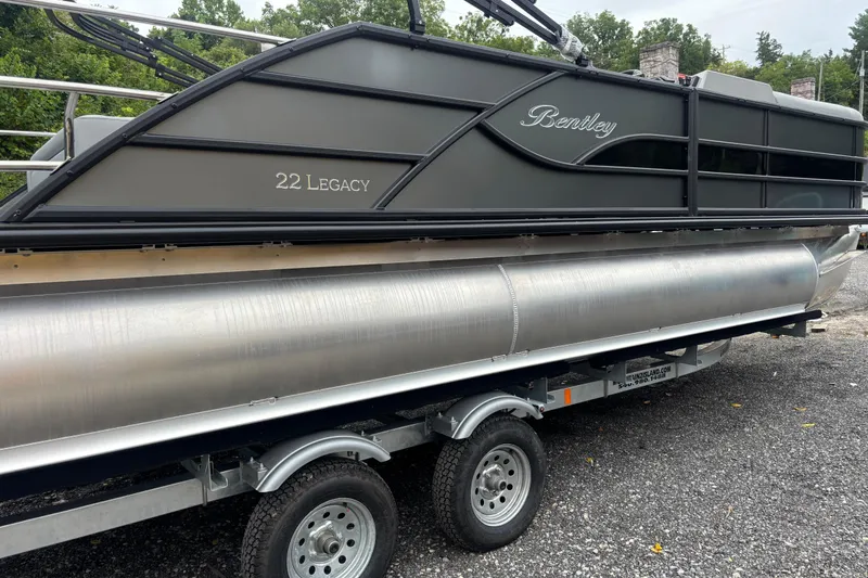 Slide: The Image of 2026 Bentley Pontoons Legacy 220 Swingback Dual Captain on trailer, side view. - 6