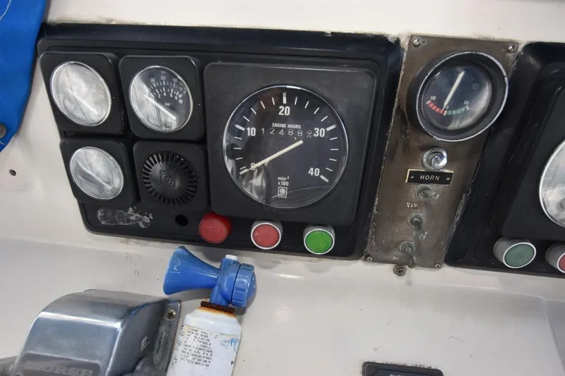 Slide: The Image of Control panel of 1987 Hartman-Palmer Offshore 38 Sundeck boat with gauges and switches. - 23