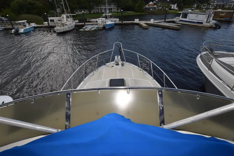 Slide: The Image of 1987 Hartman-Palmer Offshore 38 Sundeck docked at a marina, view from the deck. - 24