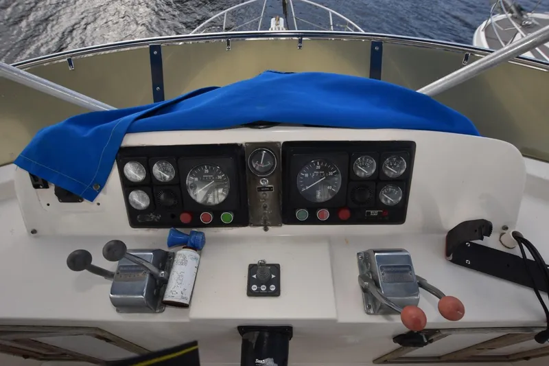 Slide: The Image of 1987 Hartman-Palmer Offshore 38 Sundeck helm with gauges and controls. - 25
