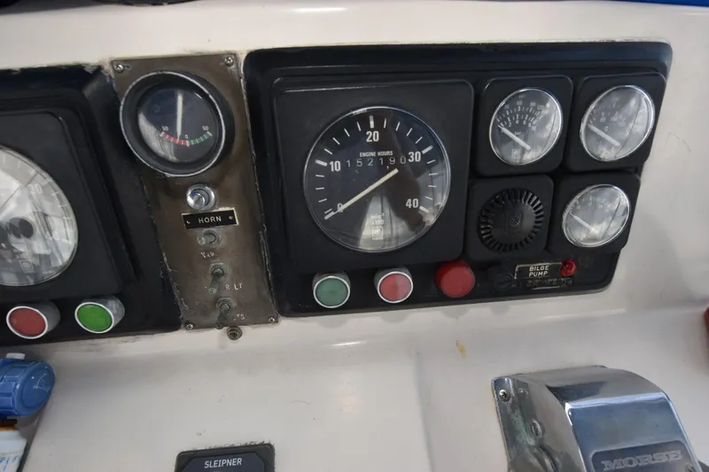 Slide: The Image of 1987 Hartman-Palmer Offshore 38 Sundeck dashboard with gauges and controls. - 26
