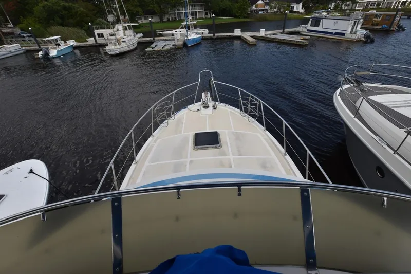Slide: The Image of 1987 Hartman-Palmer Offshore 38 Sundeck yacht docked at marina, aerial view. - 3