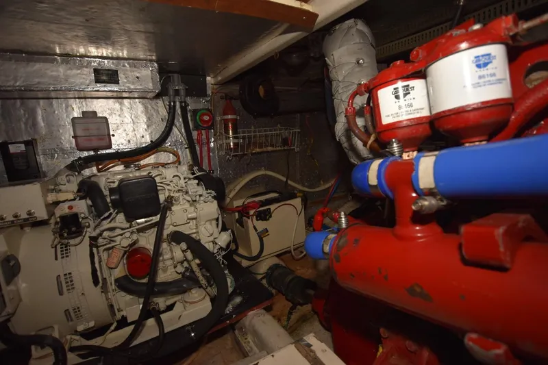 Slide: The Image of Engine room of 1987 Hartman-Palmer Offshore 38 Sundeck with visible machinery and components. - 31