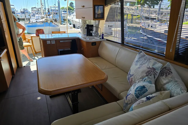 Slide: The Image of Interior of 2020 Greenline 40 yacht with cozy seating and dining area. - 11