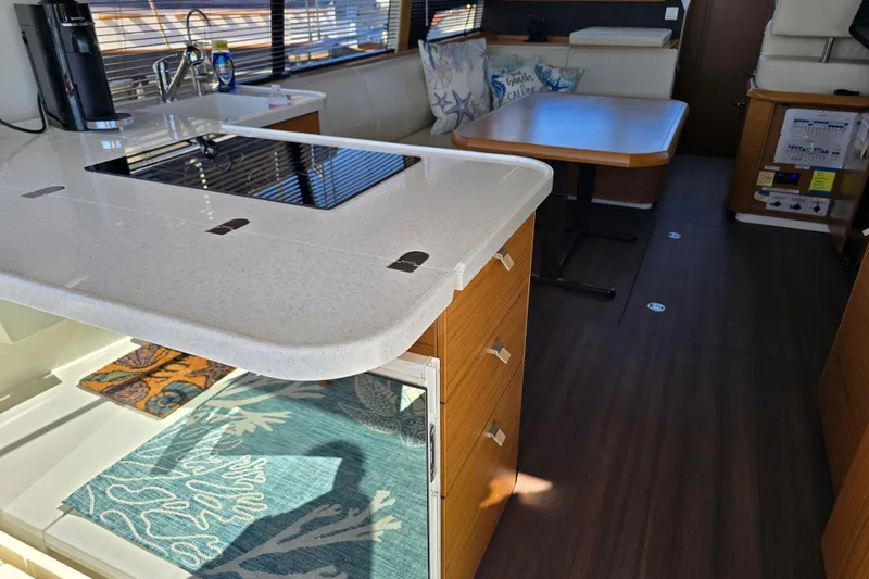 Slide: The Image of Modern interior of 2020 Greenline 40 yacht with kitchen and dining area. - 9