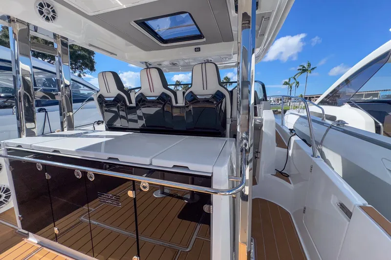 Slide: The Image of 2022 Jeanneau Leader 12.5 WA boat interior with sleek seating and modern design. - 15