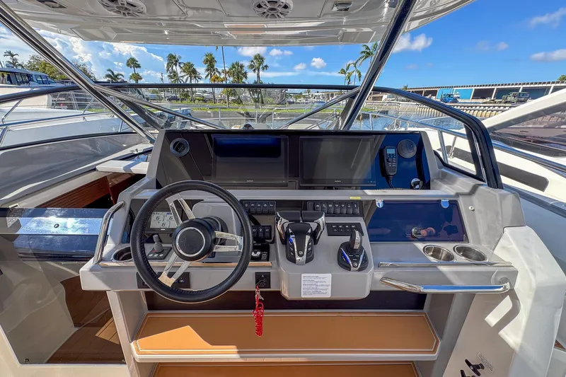 Slide: The Image of Helm of 2022 Jeanneau Leader 12.5 WA with modern controls and navigation system. - 16