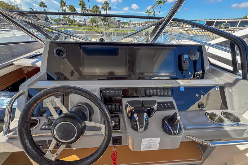 Slide: The Image of Cockpit of 2022 Jeanneau Leader 12.5 WA with modern controls and navigation displays. - 18