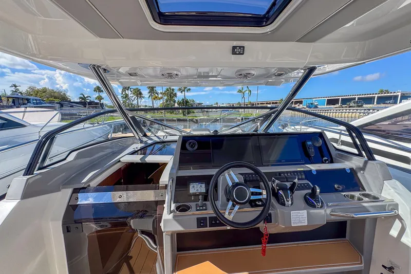 Slide: The Image of 2022 Jeanneau Leader 12.5 WA helm with modern controls and panoramic view. - 19