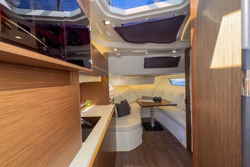 Slide: The Image of Luxurious interior of 2022 Jeanneau Leader 12.5 WA yacht with modern wood finishes. - 35