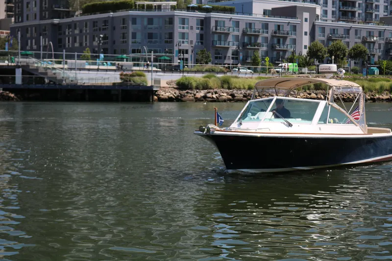 Slide: The Image of Boat on water near urban buildings, 2013 Hunt Harrier model. - 25