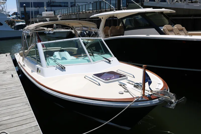 Slide: The Image of Boat cruising near modern high-rise buildings, Hunt Harrier 2013 model, urban waterfront scene. - 3