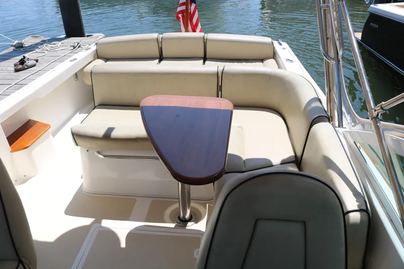 Slide: The Image of 2013 Hunt Harrier boat docked, featuring sleek design and modern amenities. - 5