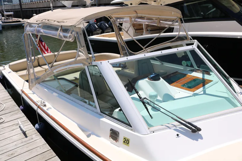 Slide: The Image of 2013 Hunt Harrier boat docked at marina, surrounded by other vessels. - 9