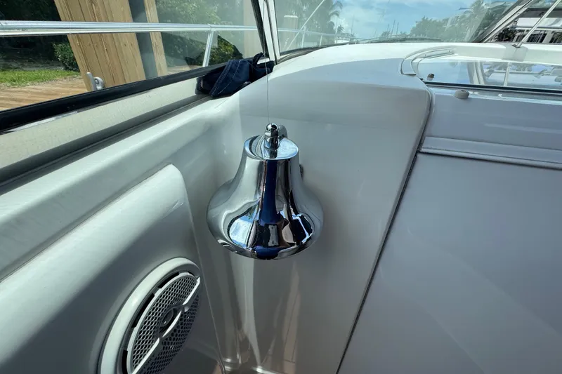 Slide: The Image of Chrome bell and speaker on 1997 Sea Ray 400 Sundancer yacht deck. - 16