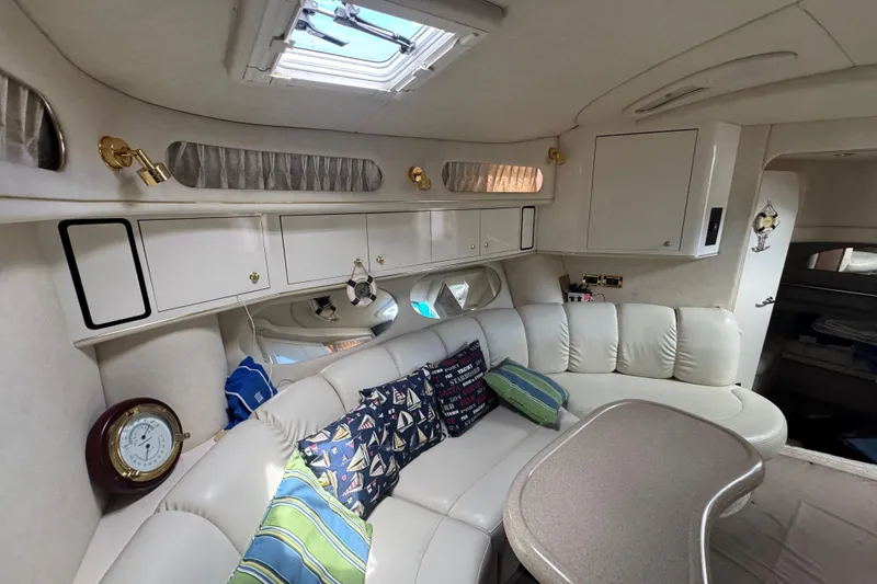 Slide: The Image of Luxurious 1997 Sea Ray 400 Sundancer cabin with plush seating and elegant decor. - 45