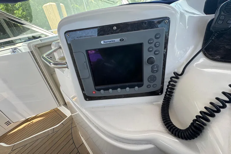 Slide: The Image of Raymarine navigation system on 1997 Sea Ray 400 Sundancer yacht dashboard. - 5