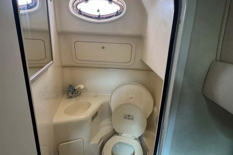 Slide: The Image of Bathroom interior of 1997 Sea Ray 400 Sundancer yacht, featuring sink and toilet. - 55