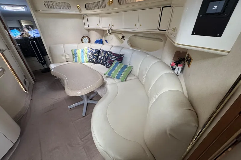 Slide: The Image of Luxurious interior of a 1997 Sea Ray 400 Sundancer with plush seating and elegant decor. - 60