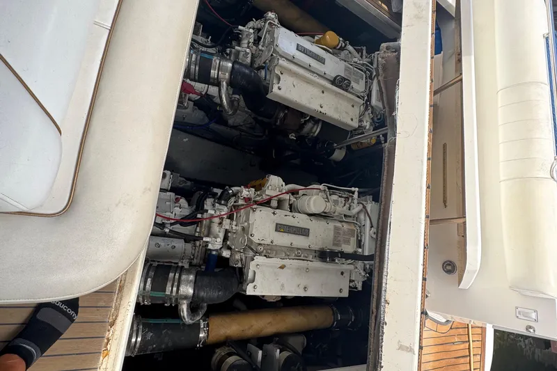 Slide: The Image of Engine compartment of a 1997 Sea Ray 400 Sundancer yacht, showcasing dual engines. - 64