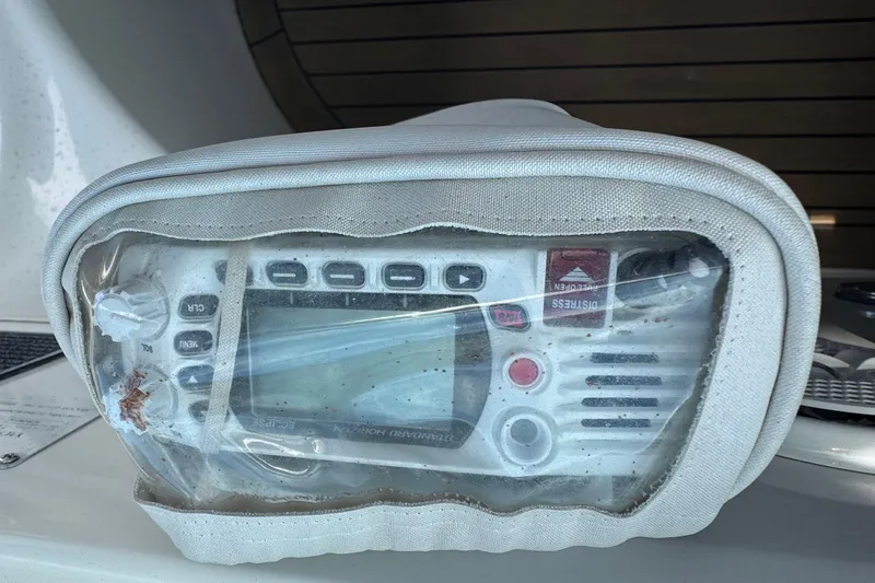 Slide: The Image of Marine radio on 1997 Sea Ray 400 Sundancer, protected by a clear cover. - 71
