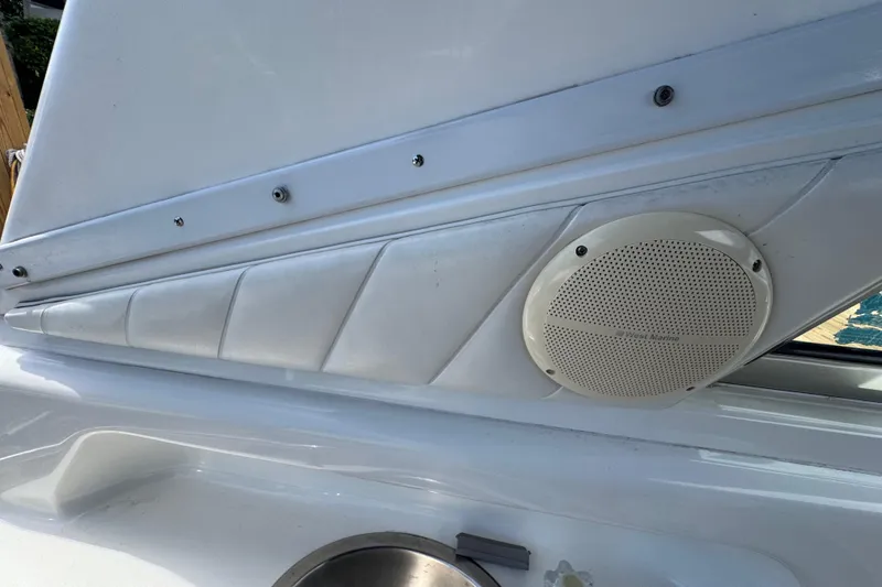 Slide: The Image of Interior detail of a 1997 Sea Ray 400 Sundancer boat with speaker and paneling. - 77