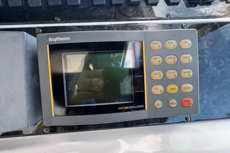 Slide: The Image of Raytheon NAV398 GPS/LORAN system on 1997 Sea Ray 400 Sundancer boat dashboard. - 8