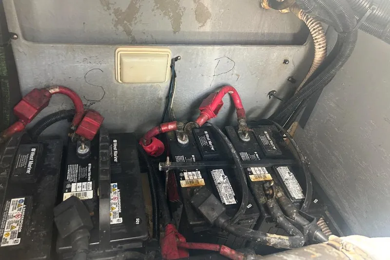 Slide: The Image of Battery compartment of a 1997 Sea Ray 400 Sundancer with visible wiring connections. - 83
