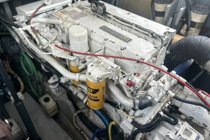Slide: The Image of Engine of a 1997 Sea Ray 400 Sundancer boat, showcasing detailed components. - 86